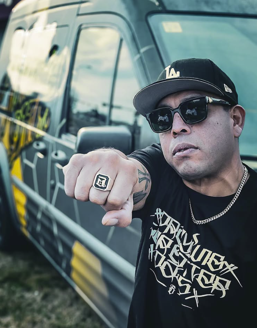 Abe Aguilar with the Beehive Worldwide supply van