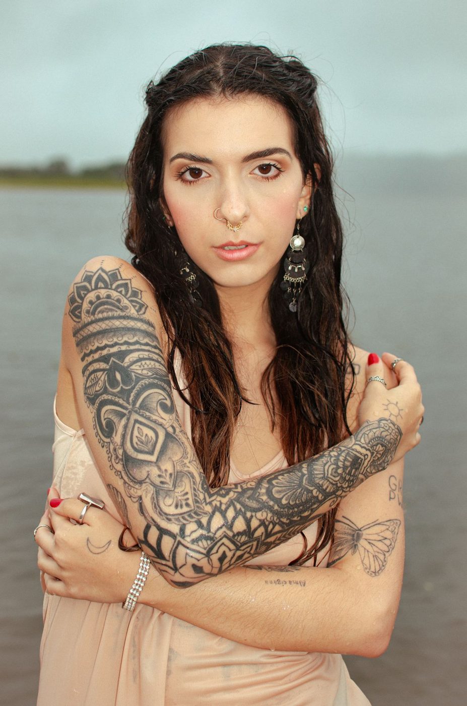 Woman with a sleeve of ornamental geometric and mandala-style patterns
