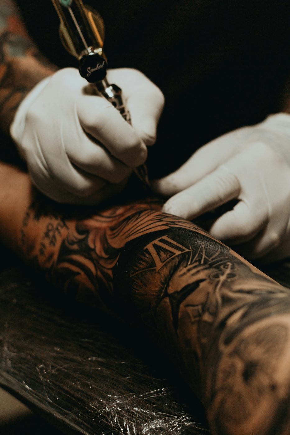 Person doing a tattoo
