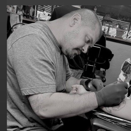 David Mariscal tattooing in his studio