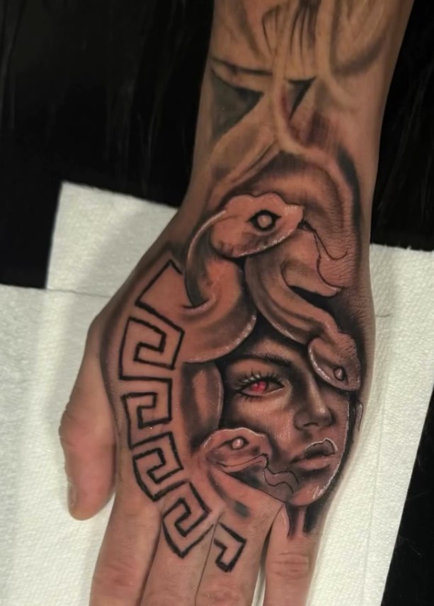 Black and grey Medusa hand tattoo by David Mariscal