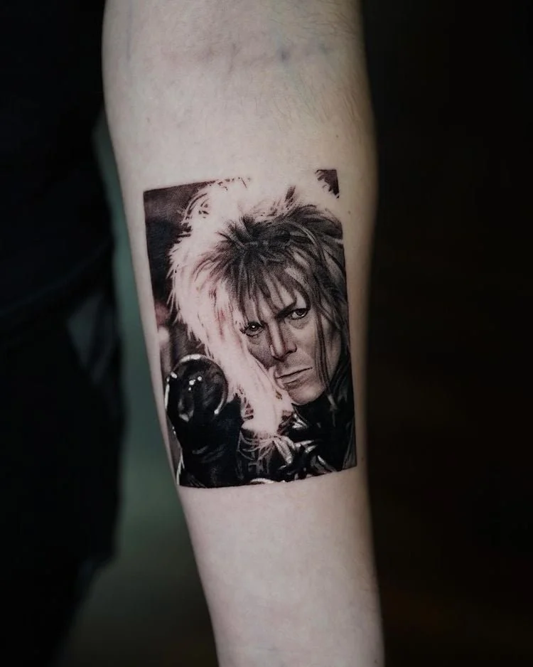 Black and grey portrait tattoo of David Bowie as the Goblin King from Labyrinth by Pony Lawson